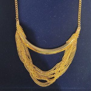 Vintage Drama: Multi-Chain Gold Bar Necklace Drips Elegance